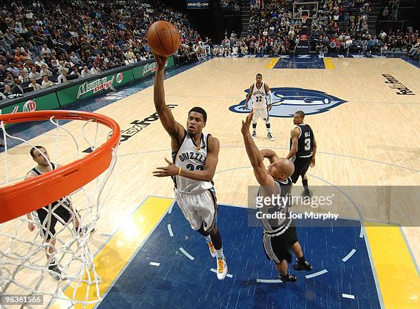 Rudy Gay of the Memphis Grizzlies shoots a layup against Richard Jefferson of the San Antonio Spurs during the game at the FedExForum on March 6,...