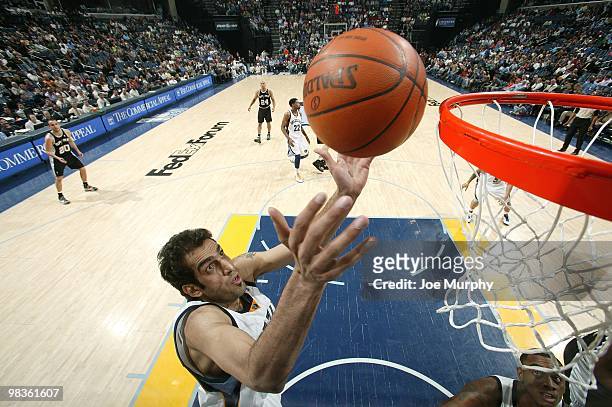 Hamed Haddadi of the Memphis Grizzlies rebounds during the game against the San Antonio Spurs at the FedExForum on March 6, 2010 in Memphis,...