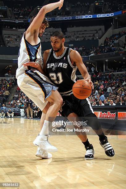 Tim Duncan of the San Antonio Spurs makes a move to the basket against Marc Gasol of the Memphis Grizzlies during the game at the FedExForum on March...