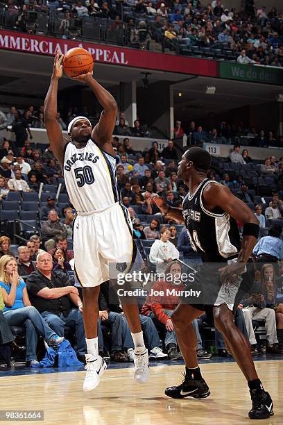 Zach Randolph of the Memphis Grizzlies shoots a jump shot against Antonio McDyess of the San Antonio Spurs during the game at the FedExForum on March...