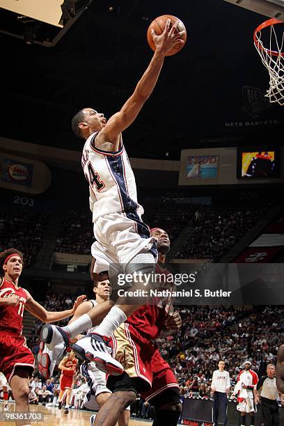 Devin Harris of the New Jersey Nets shoots a layup against LeBron James of the Cleveland Cavaliers during the game at the IZOD Center on March 3,...