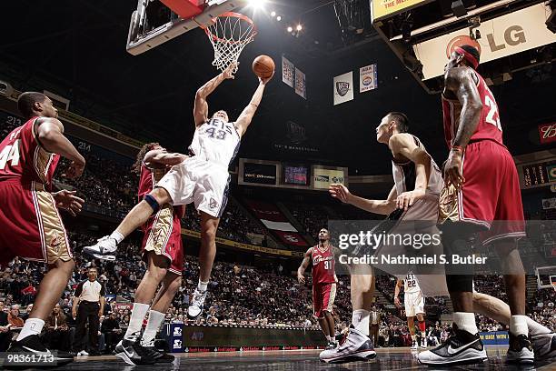 Kris Humphries of the New Jersey Nets shoots a layup against Anderson Varejao of the Cleveland Cavaliers during the game at the IZOD Center on March...