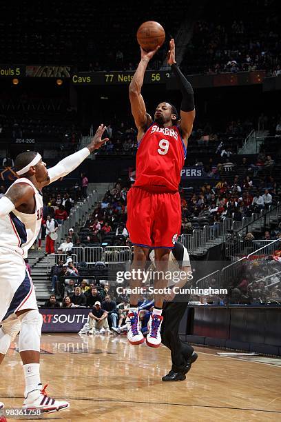 Andre Iguodala of tte Philadelphia 76ers shoots a jump shot against Josh Smith of the Atlanta Hawks during the game at Philips Arena on March 3, 2010...