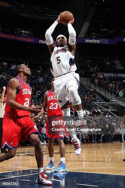 Josh Smith of the Atlanta Hawks goes up for a shot against Thaddeus Young of the Philadelphia 76ers during the game at Philips Arena on March 3, 2010...