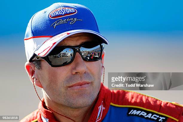 Marcos Ambrose, driver of the Kingsford/Bush's Baked Beans Toyota, looks on from the grid during qualifying for the NASCAR Sprint Cup Series Subway...