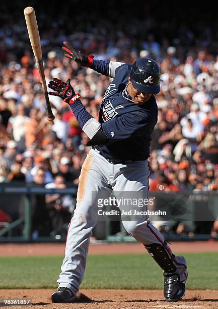 Yunel Escobar of the Atlanta Braves loses his bat against the San Francisco Giants on Opening Day at AT&T Park on April 9, 2010 in San Francisco,...