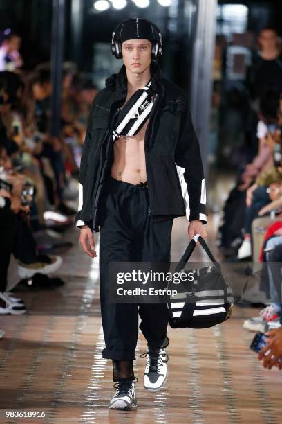 Model walks the runway during the White Mountaineering Menswear Spring/Summer 2019 show as part of Paris Fashion Week on June 23, 2018 in Paris,...