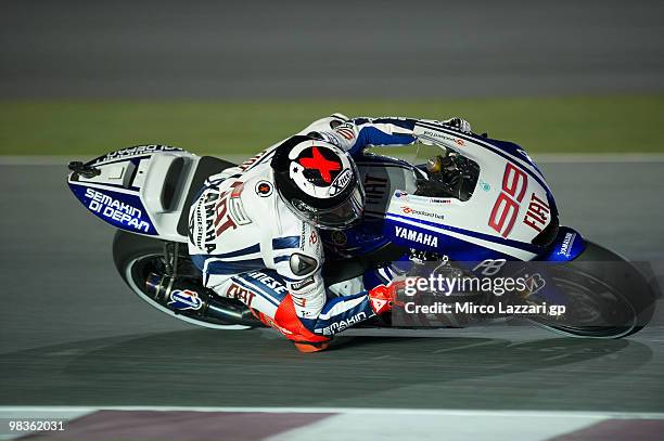 Jorge Lorenzo of Spain and Fiat Yamaha Team rounds the bend during the free practice sessione during the official photo session at Losail Circuit on...