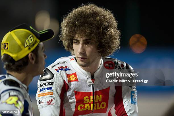 Valentino Rossi of Italy and Fiat Yamaha Team speaks with Marco Simoncelli of Italy and San Carlo Honda Gresini during the official photo session at...