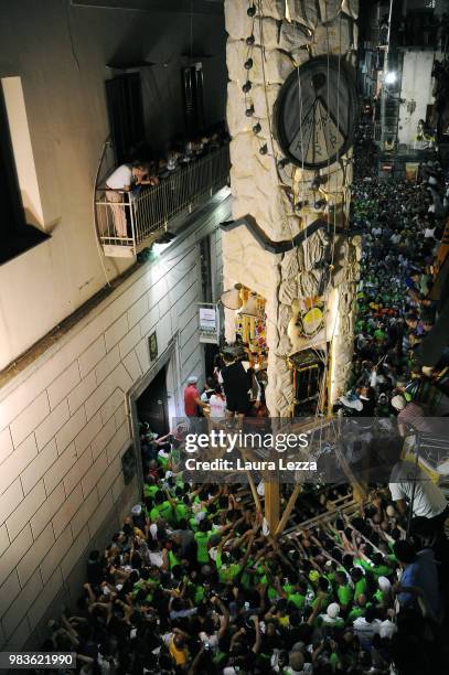 Men carry a 25-metre tall wood and papier-mache statue called 'giglio' during the annual Festa dei Gigli on June 25, 2018 in Nola, Italy. When St....