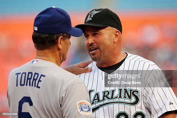 Manager Joe Torre of the Los Angeles Dodgers greets manager Fredi Gonzalez of the Florida Marlins before the Marlins home opening game at Sun Life...