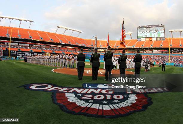 The Los Angeles Dodgers and the Florida Marlins line up for the National Anthem before the Marlins home opening game at Sun Life Stadium on April 9,...