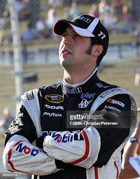 Sam Hornish Jr, driver of the Mobil 1 Dodge, looks on from the grid during qualifying for the NASCAR Sprint Cup Series Subway Fresh Fit 600 at...