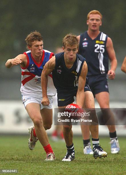 David Peel of the Falcons handballs during the round three TAC Cup match between the Geelong Falcons and the Gippsland Power at Queen Elizabeth Oval...
