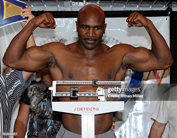 Boxer Evander Holyfield poses on the scale during the official weigh-in for his bout against Francois Botha at the Thomas & Mack Center April 9, 2010...