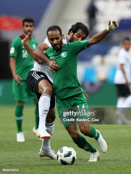 Abdullah Otayf of Saudi Arabia is challenged by Marwan Mohsen of Egypt during the 2018 FIFA World Cup Russia group A match between Saudia Arabia and...
