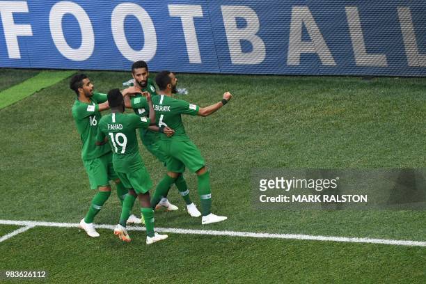 Saudi's players celebrate their equaliser during the Russia 2018 World Cup Group A football match between Saudi Arabia and Egypt at the Volgograd...