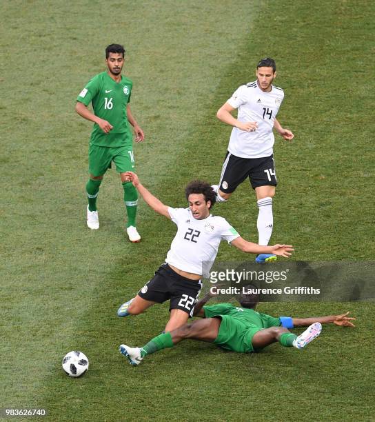 Osama Hawsawi of Saudi Arabia tackles Amr Warda of Egypt during the 2018 FIFA World Cup Russia group A match between Saudia Arabia and Egypt at...
