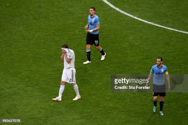 Artem Dzyuba of Russia reacts while Diego Godin of Uruguay looks on during the 2018 FIFA World Cup Russia group A match between Uruguay and Russia at...
