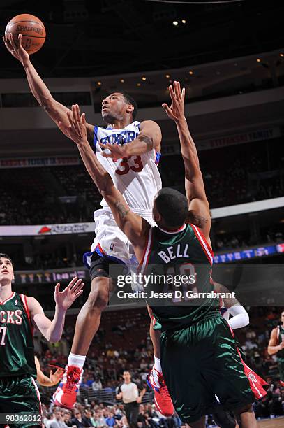 Willie Green of the Philadelphia 76ers shoots against Charlie Bell of the Milwaukee Bucks during the game on April 9, 2010 at the Wachovia Center in...