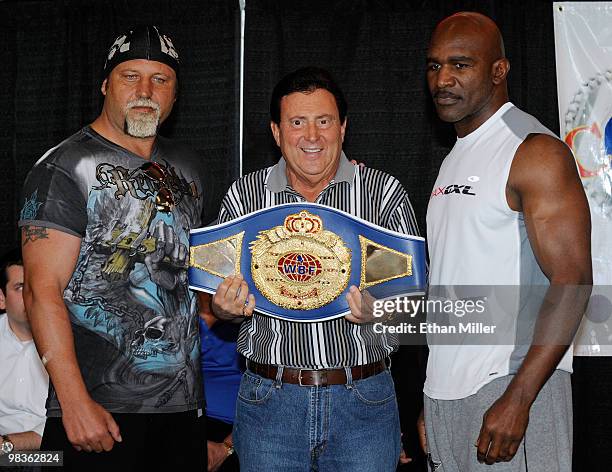 Boxer Francois Botha, Crown Boxing matchmaker Frank Luca and boxer Evander Holyfield pose during the official weigh-in for their bout at the Thomas &...