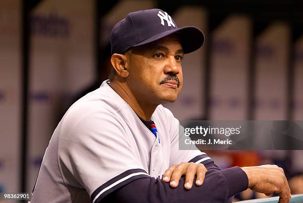 Bench Coach Tony Pena of the New York Yankees watches his team from the dugout against the Tampa Bay Rays during the game at Tropicana Field on April...