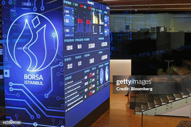 Trader talks on his phone inside the trading room of the Borsa Istanbul stock exchange in Istanbul, Turkey, on Monday, June 25, 2018. The gains in...