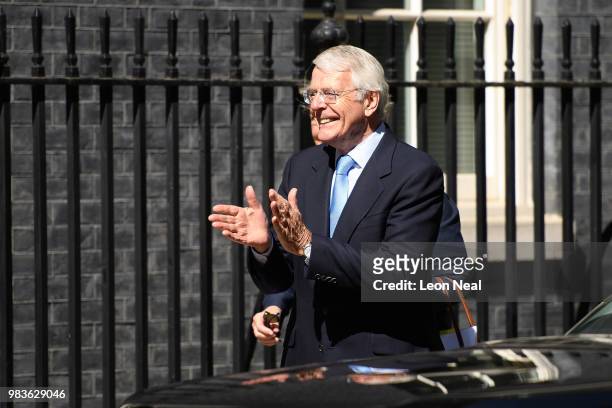 Former Prime Minister John Major is greeted as he arrives at Downing Street on June 25, 2018 in London, England.