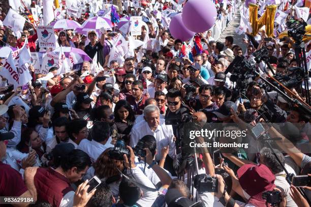 Andres Manuel Lopez Obrador, presidential candidate of the National Regeneration Movement Party , center, greats supporters during a closing campaign...