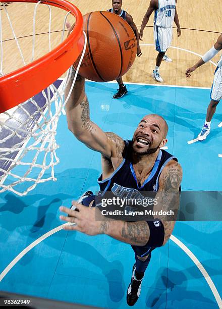Carlos Boozer of the Utah Jazz shoots against the New Orleans Hornets on April 9, 2010 at the New Orleans Arena in New Orleans, Louisiana. NOTE TO...