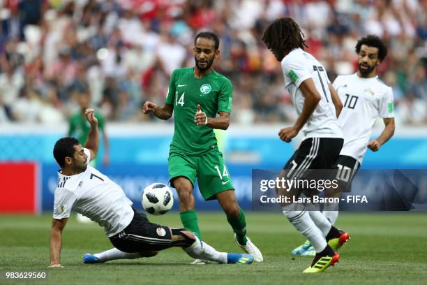 Ahmed Fathi of Egypt tackles Abdullah Otayf of Saudi Arabia during the 2018 FIFA World Cup Russia group A match between Saudia Arabia and Egypt at...