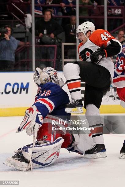 Henrik Lundqvist of the New York Rangers makes a save under pressure from Danny Briere of the Philadelphia Flyers during their game on April 9, 2010...