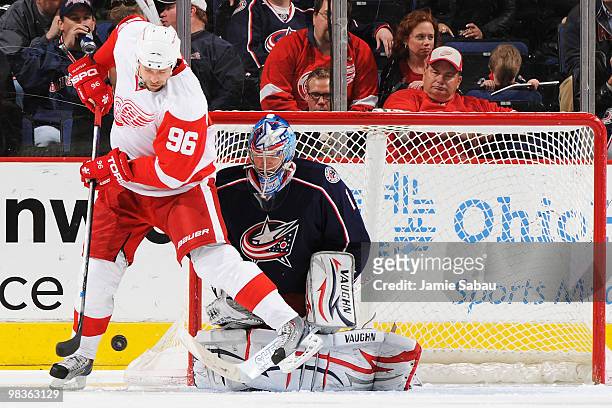 Goaltender Steve Mason of the Columbus Blue Jackets stops a shot from Tomas Holmstrom of the Detroit Red Wings during the third period on April 9,...