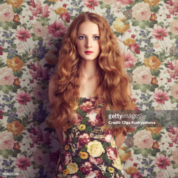 Beautiful girl on a floral background.