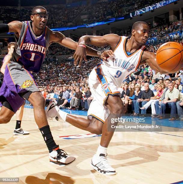 Serge Ibaka of the Oklahoma City Thunder hustles to keep the ball inbounds while being guarded by Amar'e Stoudemire of the Phoenix Suns on April 9,...