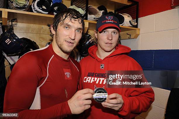 Alex Ovechkin celebrates his 50th goal and Nicklas Backstrom's 100 point of the Washington Capitals after a NHL hockey game against the Atlanta...