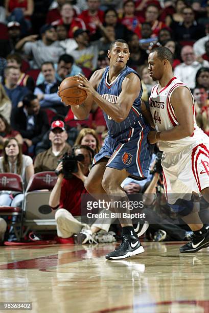 Boris Diaw of the Charlotte Bobcats drives the ball past Chuck Hayes of the Houston Rockets on April 9, 2010 at the Toyota Center in Houston, Texas....
