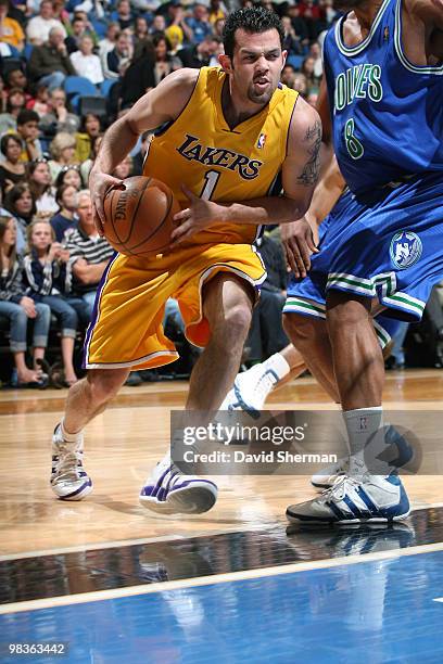 Jordan Farmar of the Los Angeles Lakers drives to the basket against Ryan Gomes of the Minnesota Timberwolves during the game on April 9, 2010 at the...