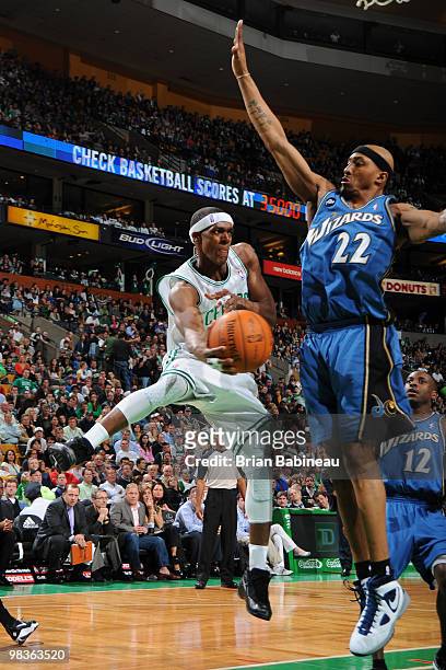 Rajon Rondo of the Boston Celtics passes the ball against James Singleton of the Washington Wizards on April 9, 2010 at the TD Garden in Boston,...