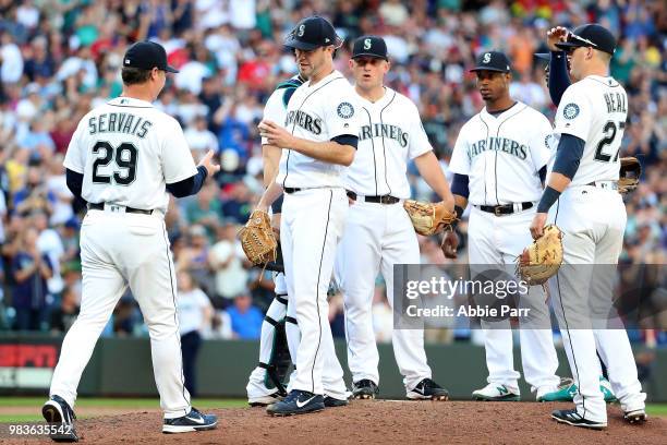 Wade LeBlanc hands the game ball over to Scott Servais of the Seattle Mariners after giving up just two hits in eight innings to the Boston Red Sox...