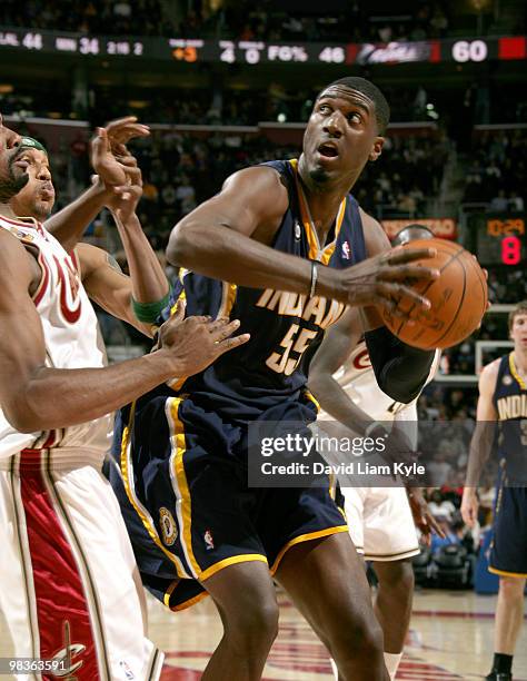 Roy Hibbert of the Indiana Pacers prepares to go up for the basket against Leon Powe of the Cleveland Cavaliers on April 9, 2010 at The Quicken Loans...