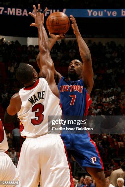 Ben Gordon of the Detroit Pistons shoots against Dwyane Wade of the Miami Heat on April 9, 2010 at American Airlines Arena in Miami, Florida. NOTE TO...