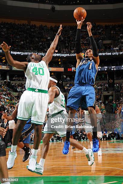 Nick Young of the Washington Wizards takes the shot against Michael Finley of the Boston Celtics on April 9, 2010 at the TD Garden in Boston,...