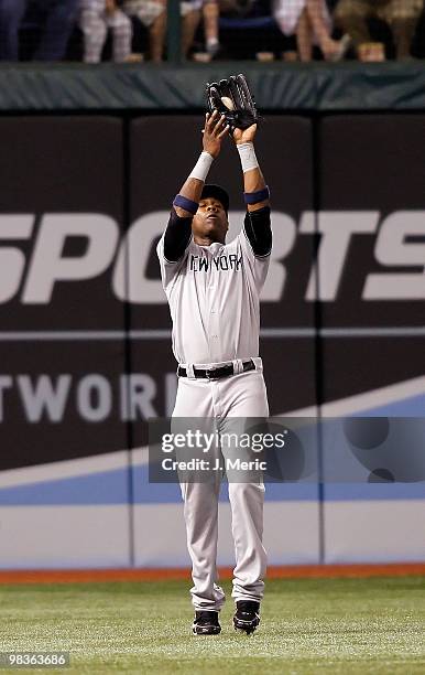 Outfielder Marcus Thames of the New York Yankees catches a fly ball against the Tampa Bay Rays during the game at Tropicana Field on April 9, 2010 in...