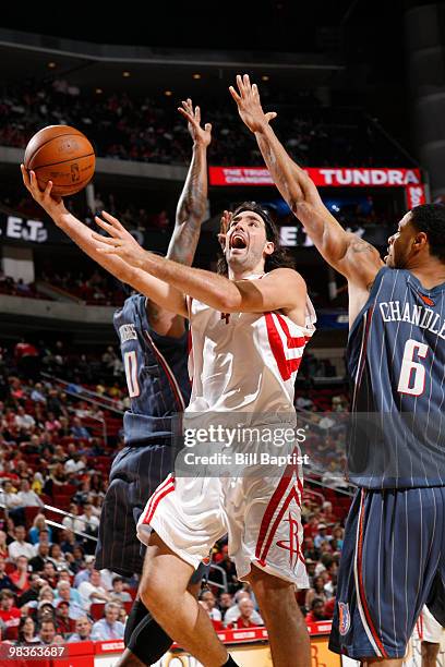 Luis Scola of the Houston Rockets shoots the ball against the Charlotte Bobcats on April 9, 2010 at the Toyota Center in Houston, Texas. NOTE TO...