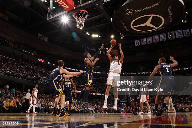 Anderson Varejao of the Cleveland Cavaliers shoots over Danny Granger of the Indiana Pacers on April 9, 2010 at The Quicken Loans Arena in Cleveland,...