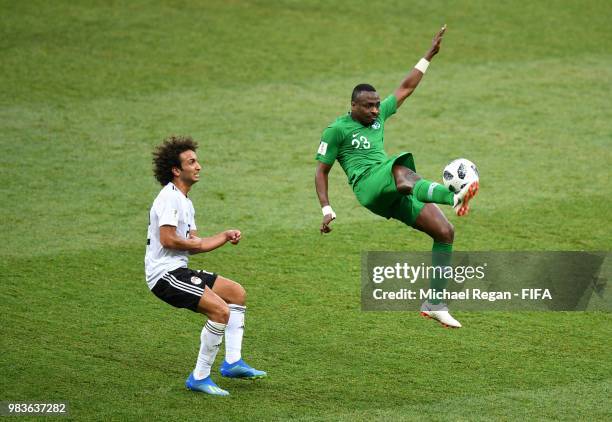 Motaz Hawsawi of Saudi Arabia controls the ball under pressure from Amr Warda of Egypt during the 2018 FIFA World Cup Russia group A match between...