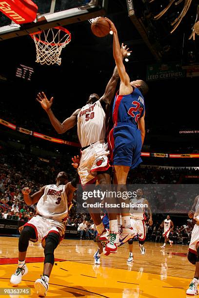 Tayshaun Price of the Detroit Pistons dunks against Joel Anthony of the Miami Heat on April 9, 2010 at American Airlines Arena in Miami, Florida....