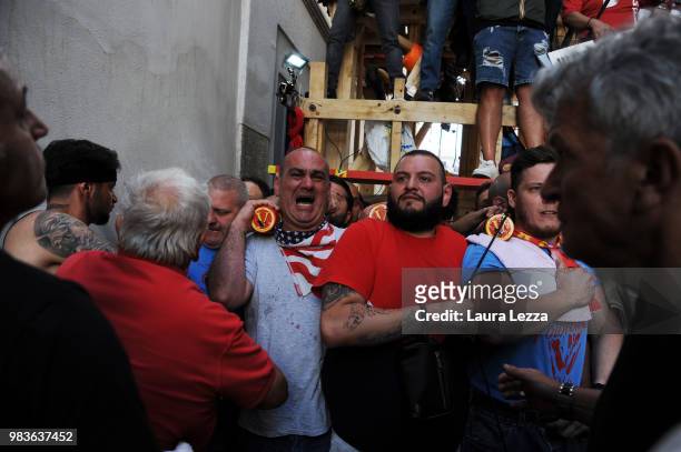 Men carry a 25-metre tall wood and papier-mache statue called 'giglio' during the annual Festa dei Gigli on June 25, 2018 in Nola, Italy. When St....