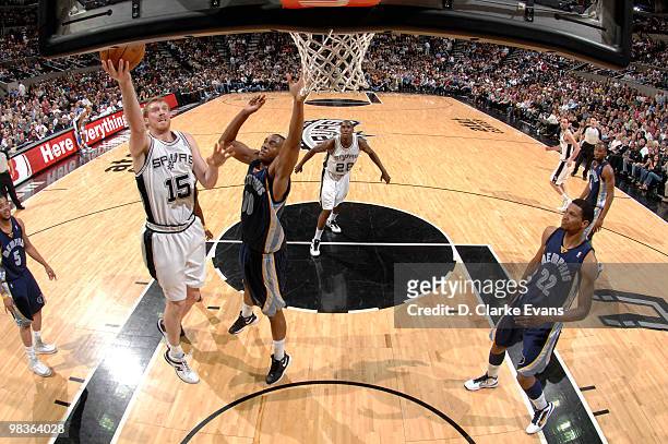 Matt Bonner of the San Antonio Spurs shoots against Darrell Arthur of the Memphis Grizzlies on April 9, 2010 at the AT&T Center in San Antonio,...
